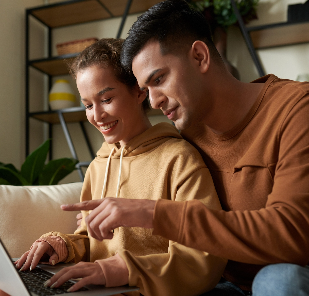 couple-using-laptop-together-at-home